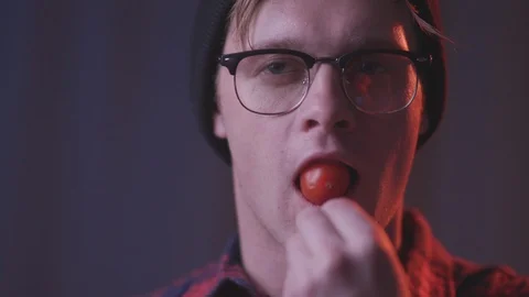 Man eat cherry tomato Stock Footage 118857765