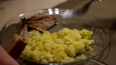 Man eates potatoes. Boiled potatoes. Mackerel Stock Footage 87506452