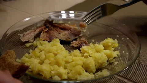 Man eates potatoes. Boiled potatoes. Mackerel Stock Footage 87553922