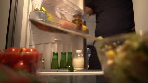 Man Eating and Drinking Beer at Night and Breaking Diet Stock Footage 77863287