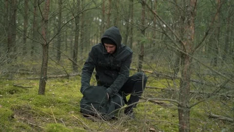 Man eating an apple in the forest Stock Footage 191841250