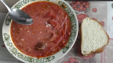 Man eating beetroot soup with sour cream Stock Footage 160261377