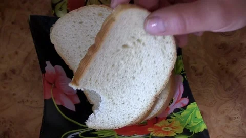 Man eating bread Stock Footage 106451330