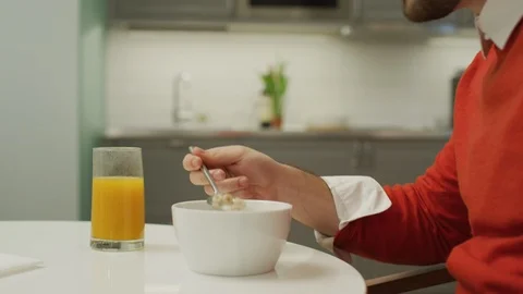 Man eating breakfast and talking Stock-Footage 99941261