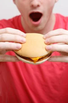 Man eating burger Stock Photos
