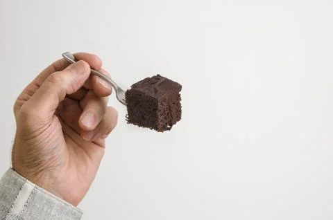 Man eating chocolate cake Stock Photos