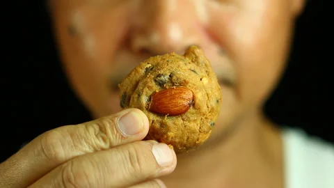 Man eating cookie  , in studio   Chiangmai  Thailand         Stock Footage 137952996