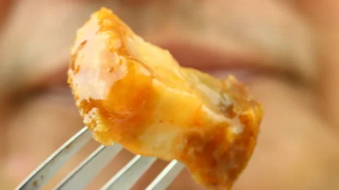 Man eating crispy pork , in studio Chiangmai Thailand. Stock Footage 151432417