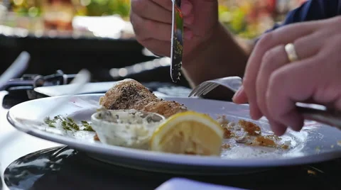 Man eating fish and chips, slow motion Stock Footage 43251155