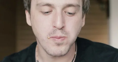 Man eating a hamburger close-up Stock Footage