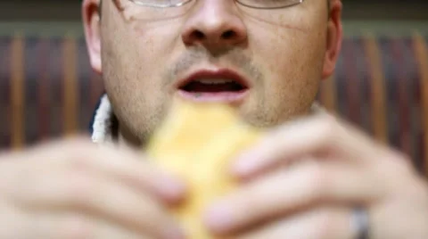 A man eating a hamburger Video stock 35520887