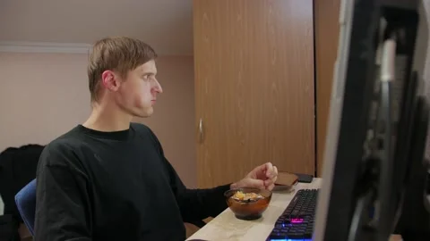 Man Eating Lunch At Computer Stock Footage 143066676
