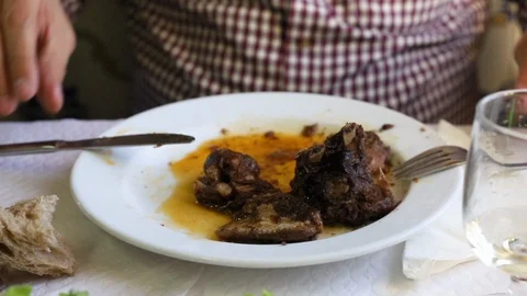Man eating meat in restaurant Video stock 105785377