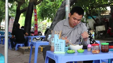 Man eating noodles Stock Footage 58625917