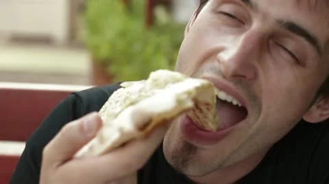Man eating pizza in cafe Stock Footage 20470640