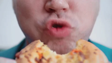 The man is eating pizza. Close-up. Stock Footage 145169013