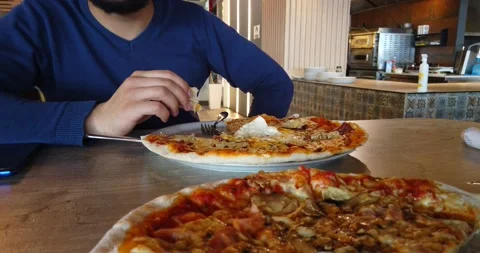 The man eating pizza Stock Footage 170256944