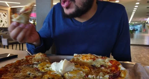 The man eating pizza Stock Footage 170256946