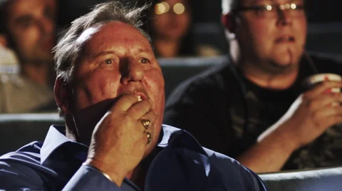 Man Eating Popcorn Stock Footage 62917525