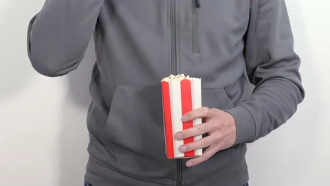 Man eating popcorn Stock Footage 152930184