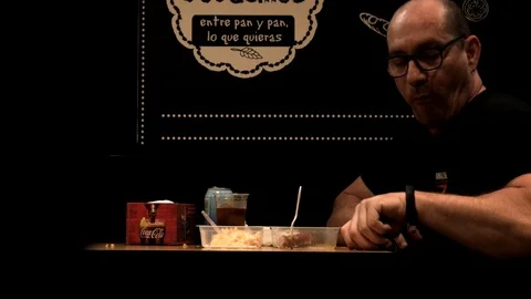 Man eating in a restaurant Stock Footage 115698994