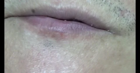 Man eating roasted peanuts Stock Footage 313025593