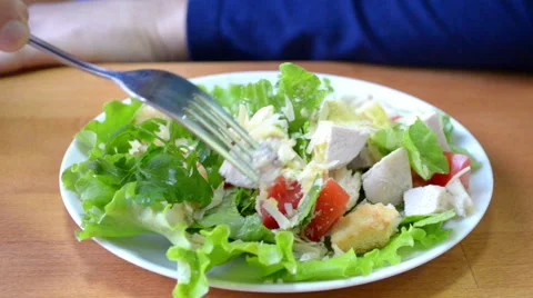 Man eating salad in a cafe Stock Footage 44982257