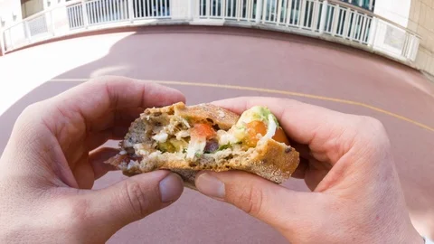 A man eating a sandwich Video stock 104069339