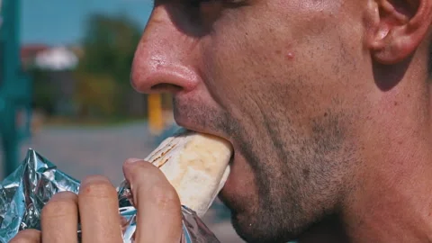 Man Eating Shawarma Close Up Video stock 284605637