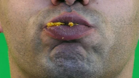 Man Eating Snack In Closeup Stock Footage 97724236