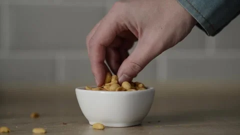 Man eating snacks with appetite. Stock Footage 245610761
