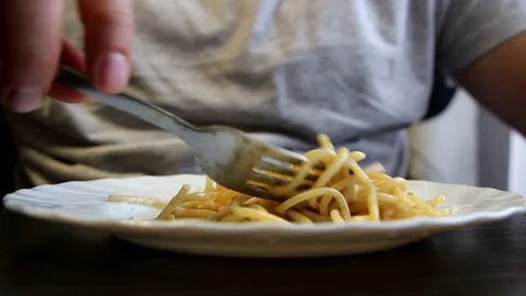 Man eating spaghetti Stock Footage 96849872