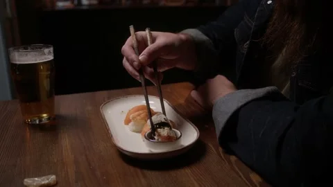 Man eating sushi Stock Footage 223884013
