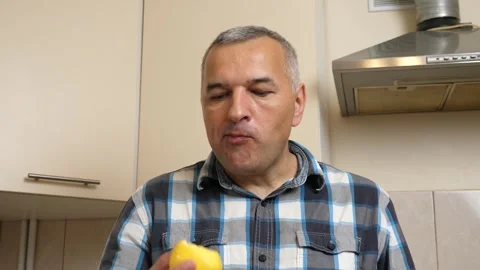 Man eating a yellow apple. Close-up Stock Footage 324953561