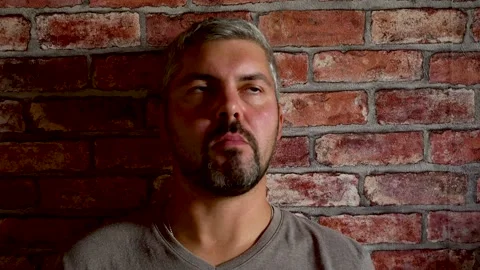 Man eats and looks up 4K Stock Footage 160119372