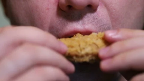 Man eats breaded chicken wings. close-up Stock Footage 118325301