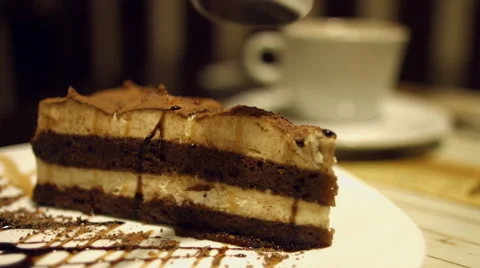 Man eats for breakfast chocolate cake with coffee. Stock Footage 59960563