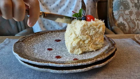 A man eats a cake in a cafe Stock Footage 244209969