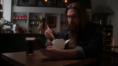 A man eats Chinese noodles Stock Footage 223881326