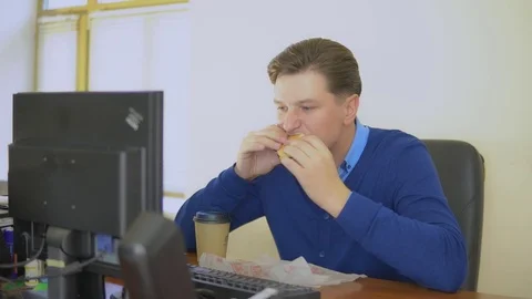A man eats fast food in the office. Stock Footage 82530758