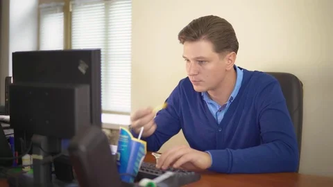 A man eats fast food in the office. Stock Footage 82546281