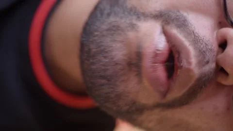 Man eats food from plastic fork close up shot, close up shot of man eating .. Stock Footage 332264019