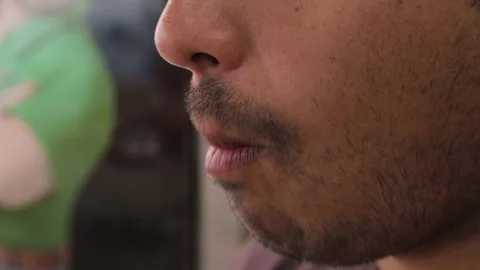 Man Eats Food Sample on Stick at Sydney Market, Close-Up of Face and Mouth Stock Footage 345702176