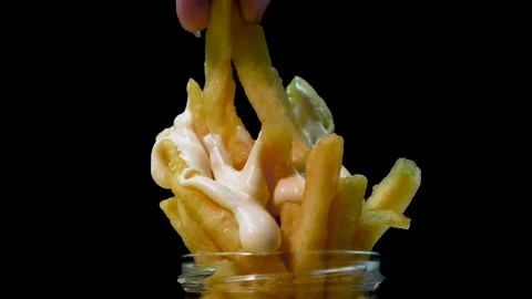 A man eats fried potatoes with mayonnaise, appetizing french fries Stock Footage 222843575