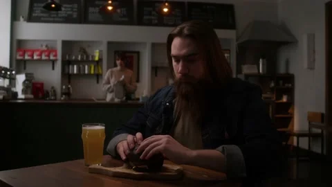 A man eats a hamburger Stock Footage 223881112