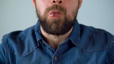 Man eats juicy hamburger Stock Footage 85660258