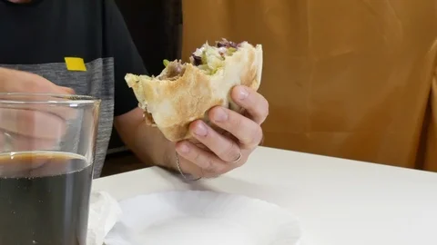 The man eats kebabs with his hands Stock Footage 91136343