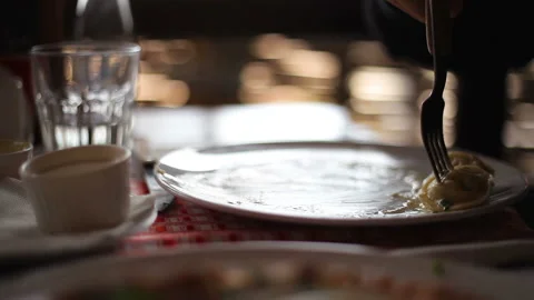 A man eats the last three dumplings from a plate, Close-up Stock Footage 150275235