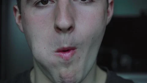 Man eats meat standing in front of the camera 스톡 동영상 140907756