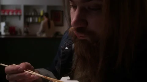 A man eats noodles Stock Footage 223881348